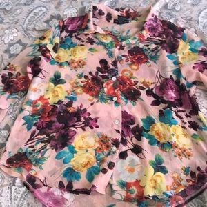 About a girl floral blouse. With pearl finish buttons